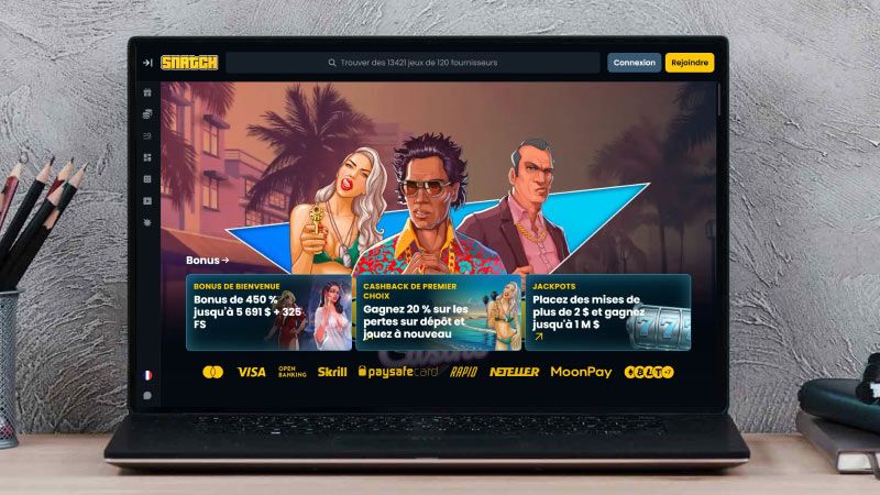 Écran d'ordinateur portable avec une capture d'écran de Snatch Casino