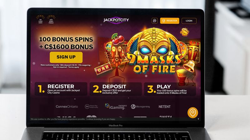 a laptop mockup with the jackpot city casino main page in it