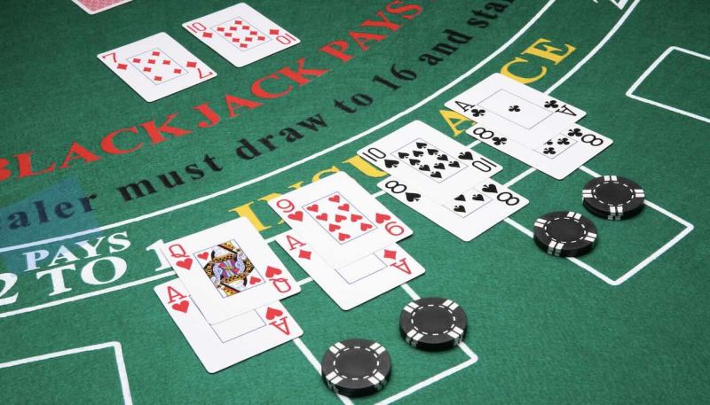 blackjack table with cards and chips on it